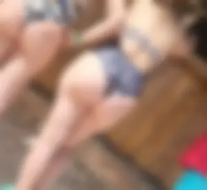 Milf in bikini with her friend at the beach bar