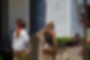Two sexy friends in Florida walking in thong bikinis with nice asses
