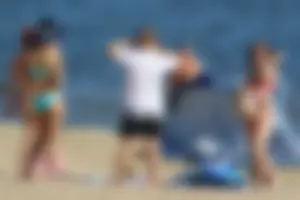Couple of hot babes hanging out at the beach in bikinis