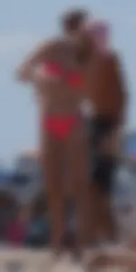 Sexy and skinny girl on the beach in pink bikini