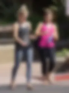 Skinny blonde in grey leggings with a friend