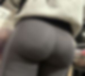 Closeup of a hot candid girl's bubble ass in yoga pants - wearing a grey hoodie at the supermarket