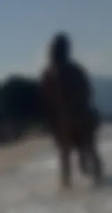 Smooth bodied and sexy blonde at the beach in a thong bikini