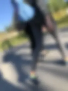 Skinny Girl in Grey Leggings Walking Past the Camera Candid Photos Gallery