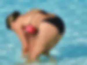 Sexy milf with a nice mom bod in a bikini in the pool