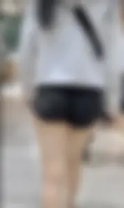 Asian girl in tight black shorts at the mall