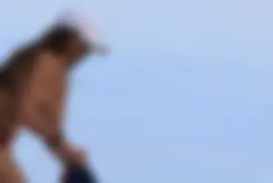 Sexy girls topless on a nude beach showing their nice tits