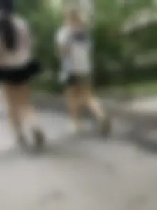 Couple of candid teens walking down the street