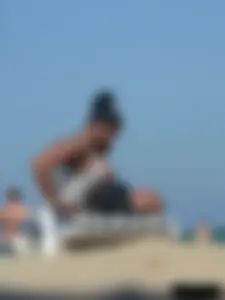 Hot ass topless beach girl with great tits lets her little brother oil up her ass in thong bikini