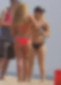 Sexy thick blonde girl with tiny bikini and big booty on the beach