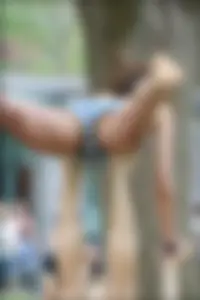 Gymnast or yoga girl in the park in shorts and no bra and even showing some pussy