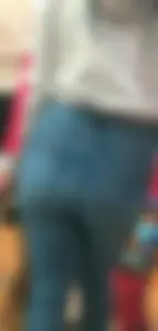 Skinny brunette with a nice booty in line in tight jeans