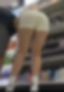 Amazing Asian in white yoga shorts upshot bends squat at Target