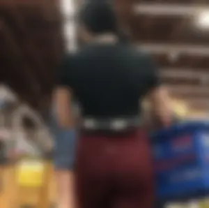 Girl with a nice ass in maroon leggings shopping