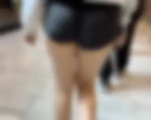 Asian girl in tight black shorts at the mall