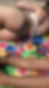 Friends on the beach in bikinis and flashing