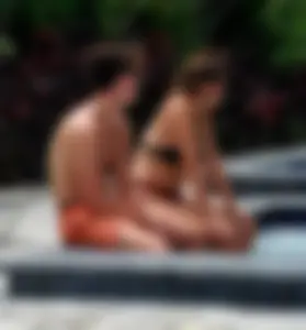 Jacuzzi girl with a nice ass in semi thong bikini and some cleavage