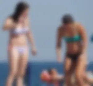2 cute friends in bikinis on the beach
