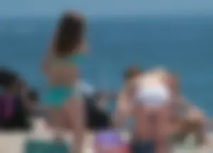 Bunch of sexy babes at the beach in bikinis