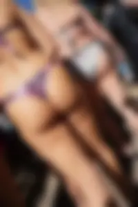 Two nice asses in thong bikinis at a Disney waterpark
