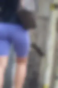 Wide hipped, juicy fronted tanned brunette pawg struts in lycra shorts