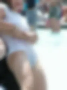 Candid young candid girl in wet panties and T-shirt playing in fountain