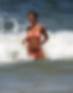 Orange thong bikini babe on the beach with a great ass
