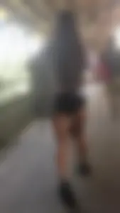 Brunette babes cheeks in tiny shorts walking