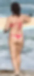 Thick brunette milf on the beach in red thong bikini