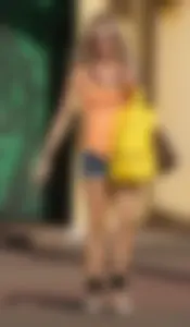 A skinny blonde milf in shorts in the parking lot