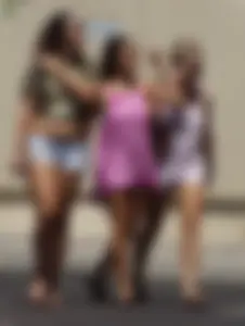 Three girls on the way to the ice cream parlor