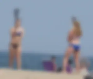 3 girls on the beach in bikinis with big boobs, one brunette and two blondes