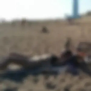 Skinny Girl with Flat Belly on the Beach with Her Bike