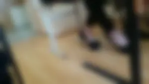 Feet in High-Heeled Shoes Closeup in College Classroom