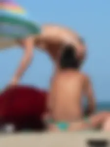 Bunch of sexy babes on the beach topless and in thong bikinis