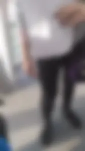 Girl wearing a black skirt over her leggings