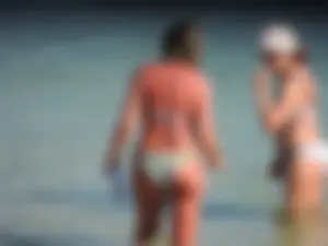 Blonde milf on the beach in her bikini