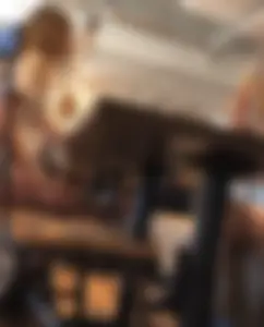 Sexy cowgirls in jean shorts sharing a meal (bonus waitress)