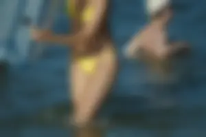 Milf in Yellow Swimsuit Beach Candid Gallery