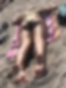 Two nice sunbathers with nice asses