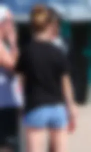 Candid skinny college girl in denim shorts showing some cheeks