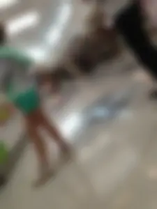Nice Crossed Thin Legs in Shorts at the Mall
