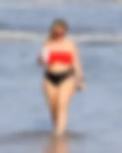 Thick BBW blonde lady in a bikini at the beach