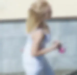 Awesome blonde candid chick wearing white polka-dot pants passing by on the street, closeup of her ass