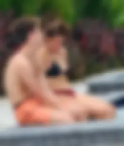 Jacuzzi girl with a nice ass in semi thong bikini and some cleavage