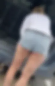 College chick in short shorts bending over with cheeks out