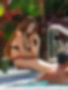 Jacuzzi girl with a nice ass in semi thong bikini and some cleavage