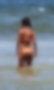 Orange thong bikini babe on the beach with a great ass