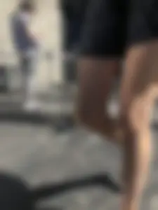 Long Skinny Legs in a Skirt and Feet in Sandals Closeup Creepshots on the Street