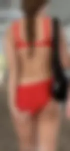 Beauty picks at her bikini wedgie